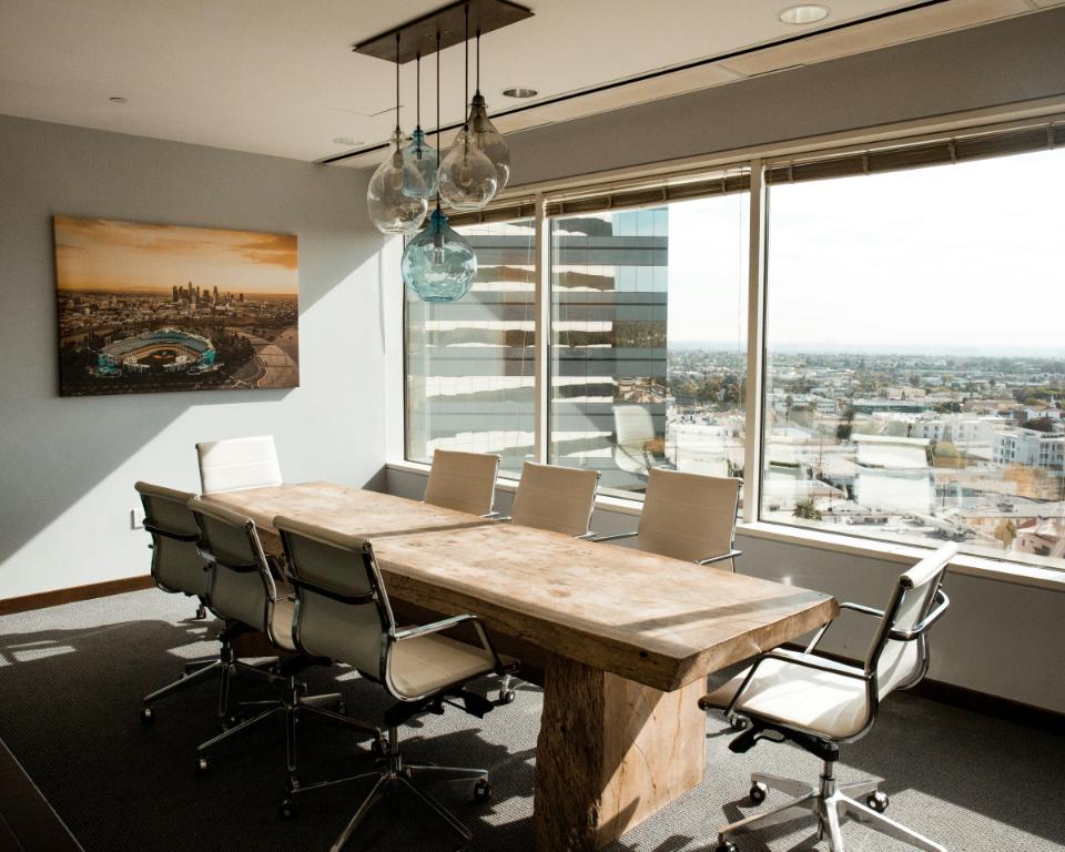 conference room with a table, chairs, and window