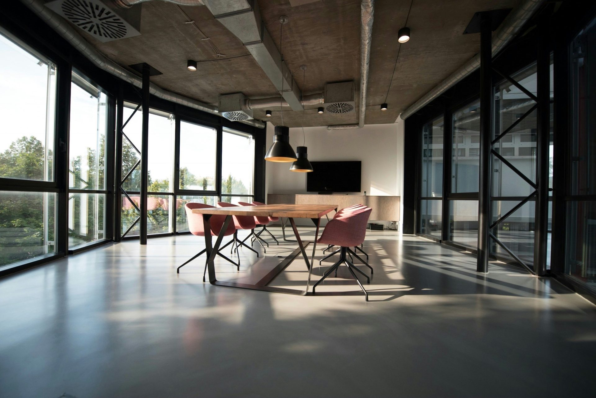 conference room with table, chairs, and TV